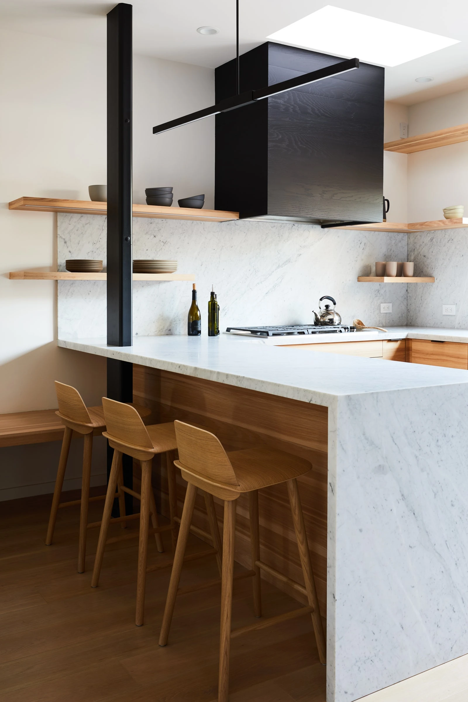 This image may contain Indoors Room Kitchen Furniture Wood and Kitchen Island