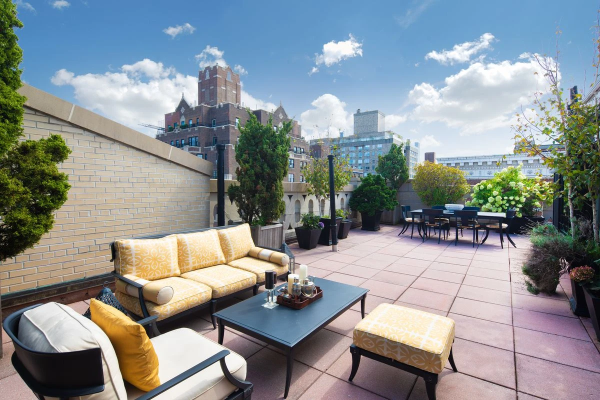 Outdoor terrace with an outdoor seating set and dining set.